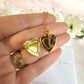Gold forget me not flower heart locket necklace.