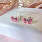 925 Sterling Silver Pink bow stud earrings.