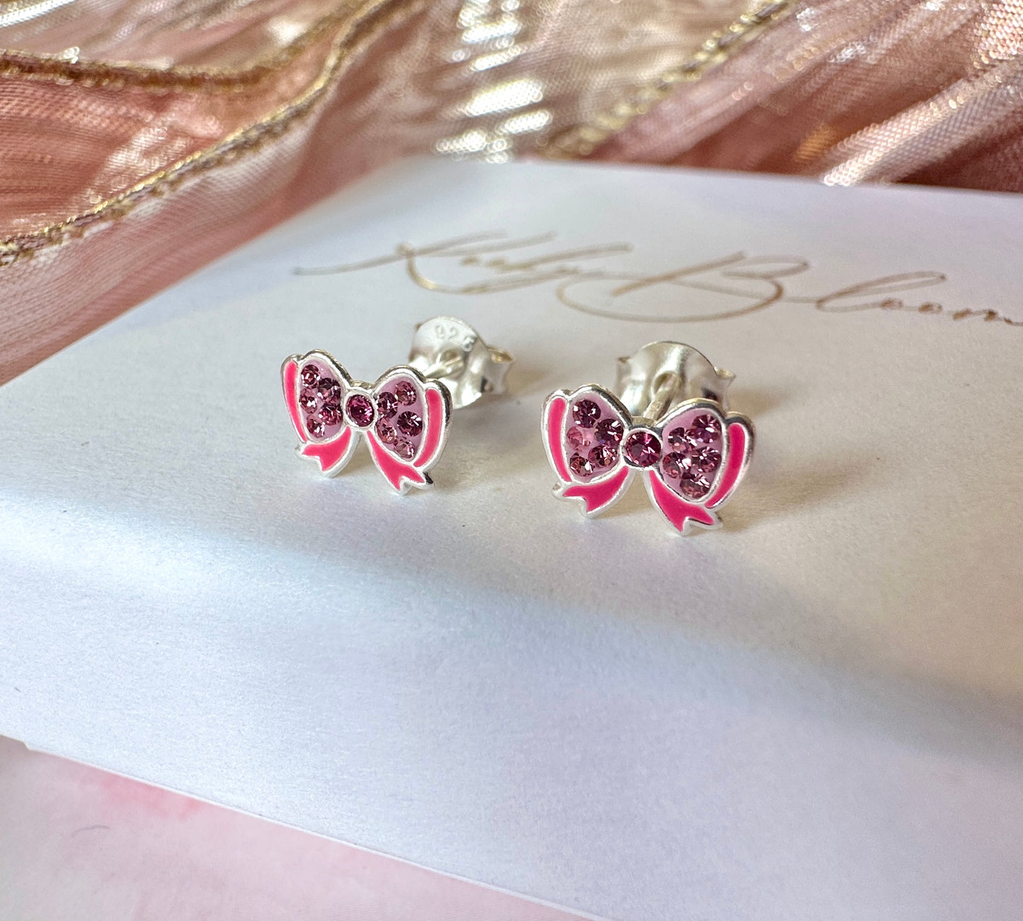 925 Sterling Silver Pink bow stud earrings.