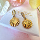 Gold seashell CZ huggie earrings.