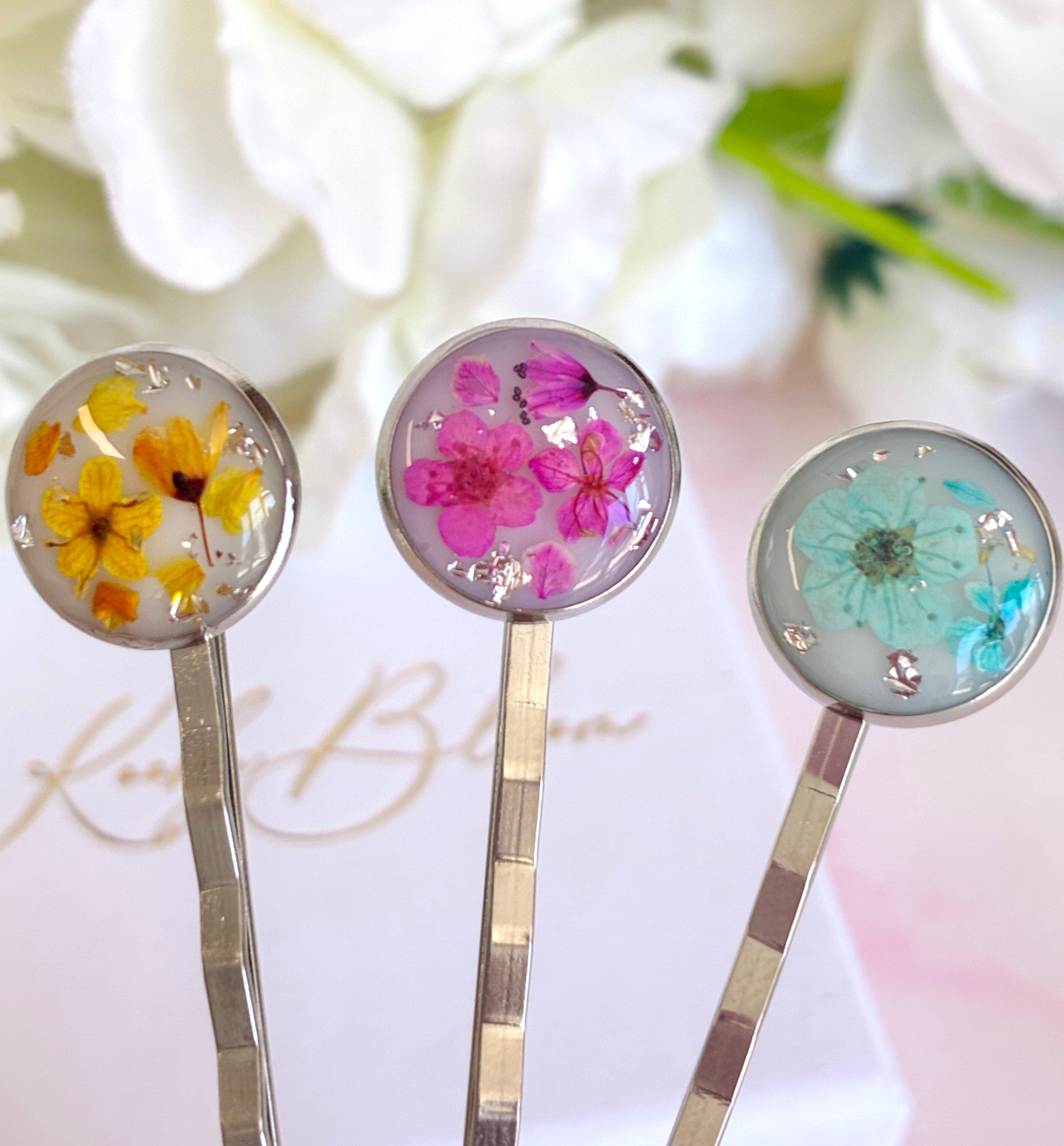 Silver set of 3 Bloom flower hair slides.