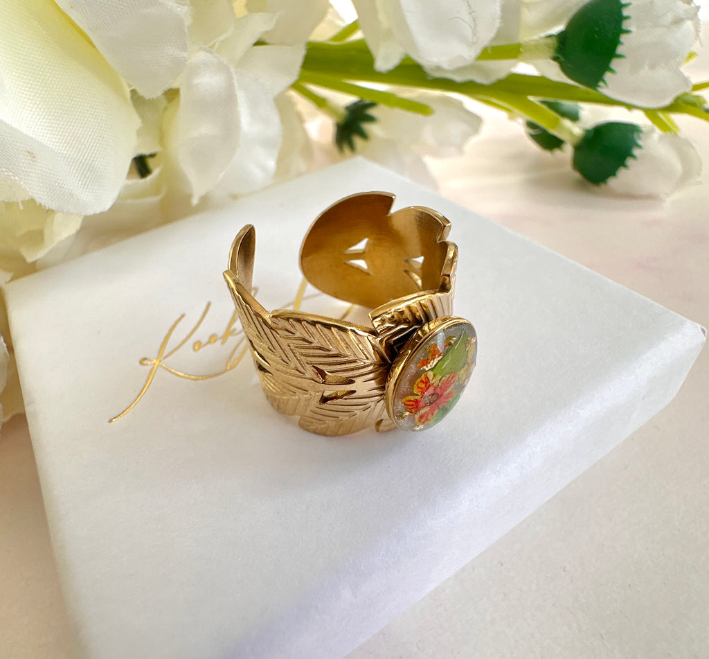 Gold wide Green orange Bloom Leaf cuff ring.