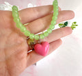 Glass green beaded pink heart necklace.