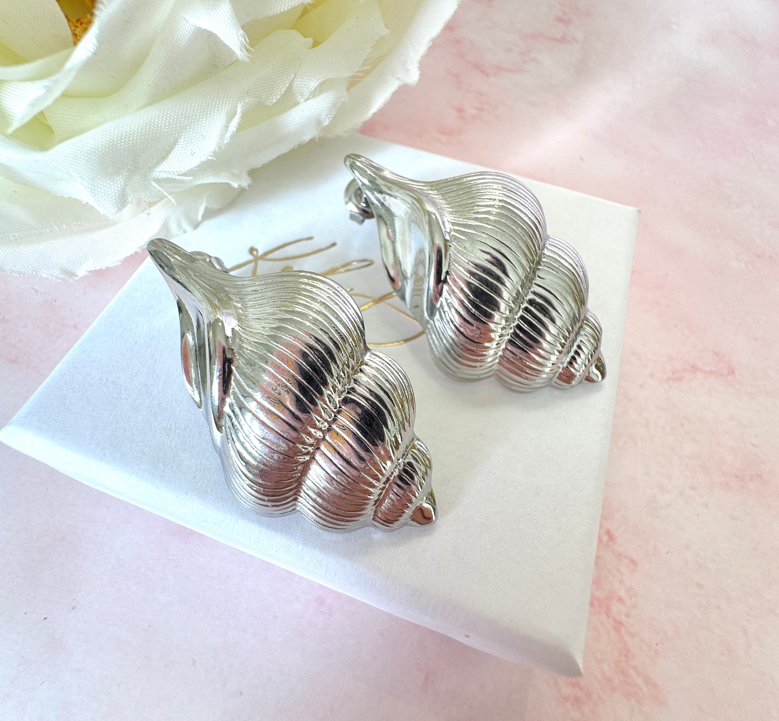 Silver oversized Seashell stud earrings.