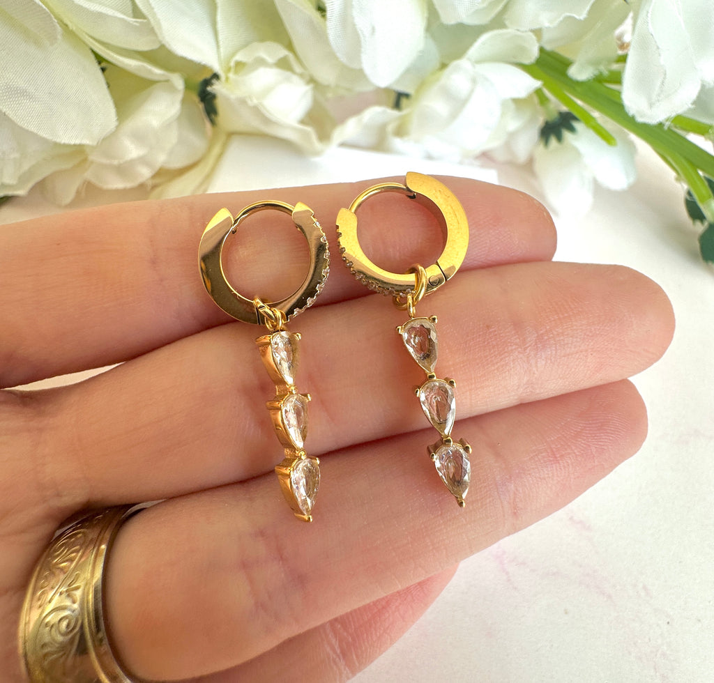 Gold Triple CZ Drop huggie earrings.