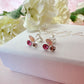 925 Sterling silver peach opal pink cz stud earrings.