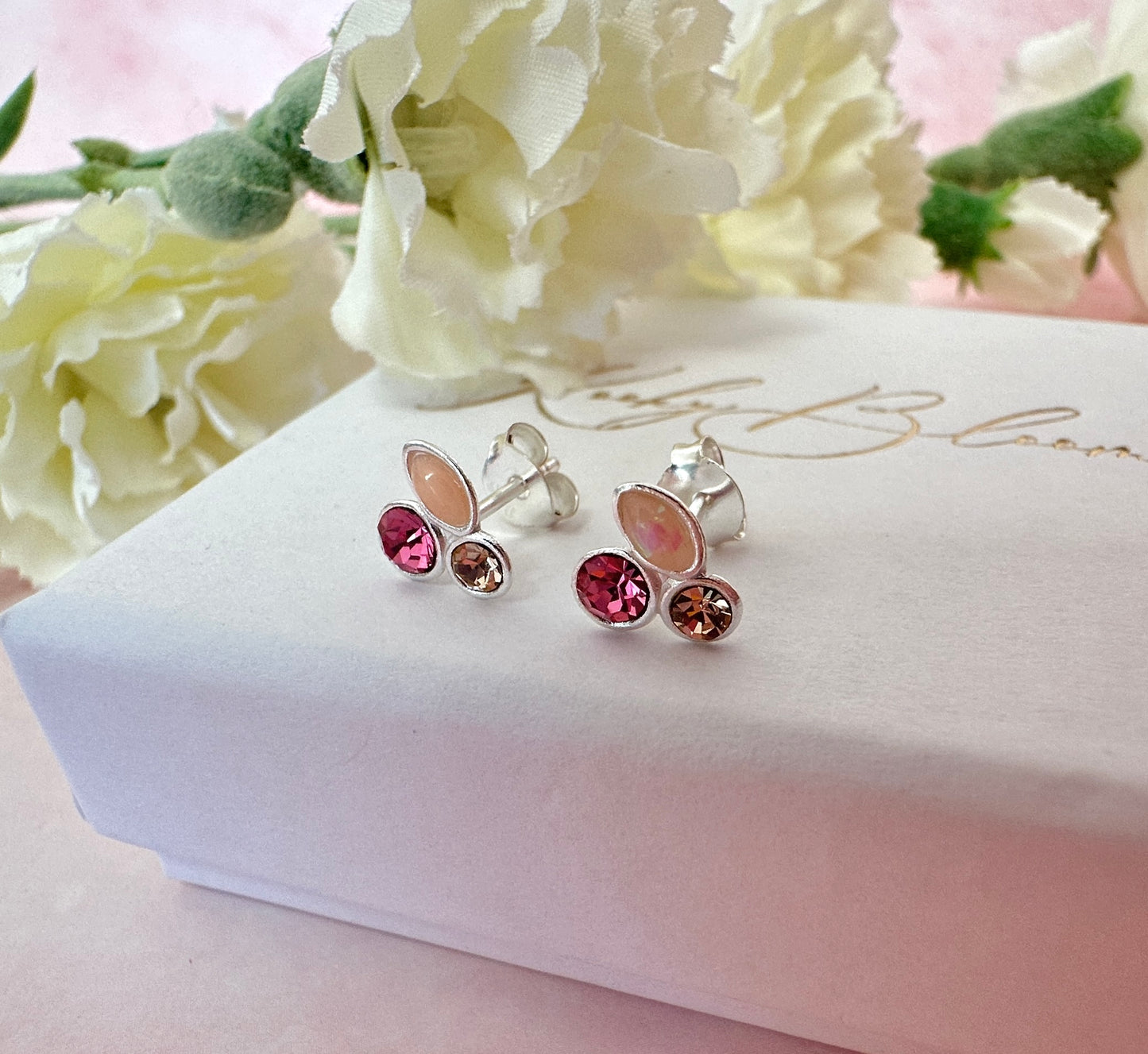 925 Sterling silver peach opal pink cz stud earrings.