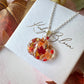 Silver Pumpkin bloom necklace.