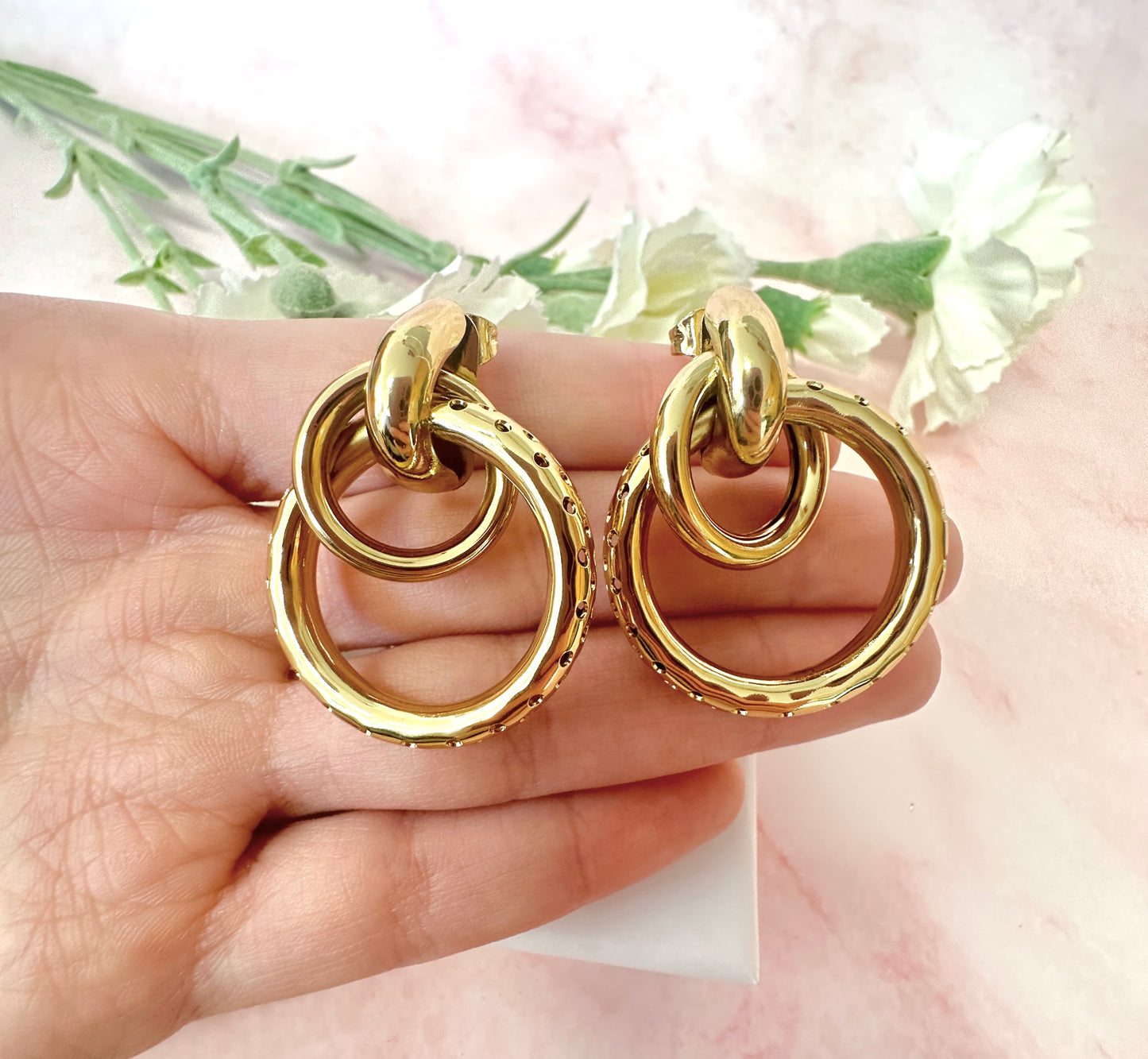 Gold oversized Double ring stud earrings.