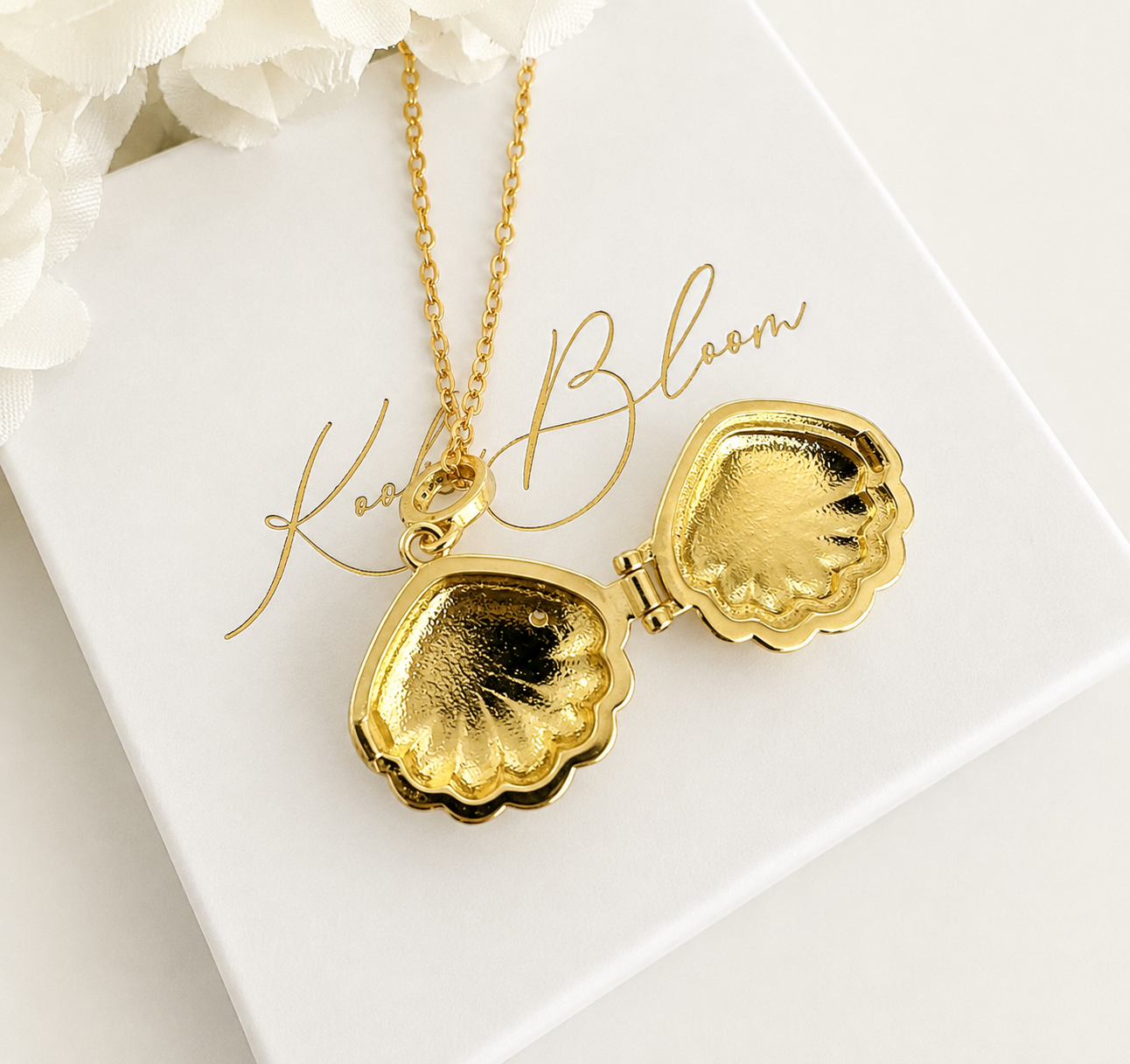 Gold Blue enamel Seashell locket necklace.