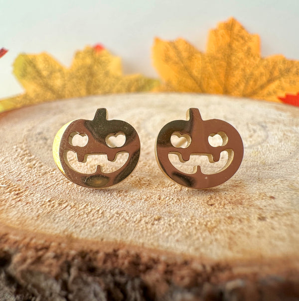 Gold pumpkin stud earrings.