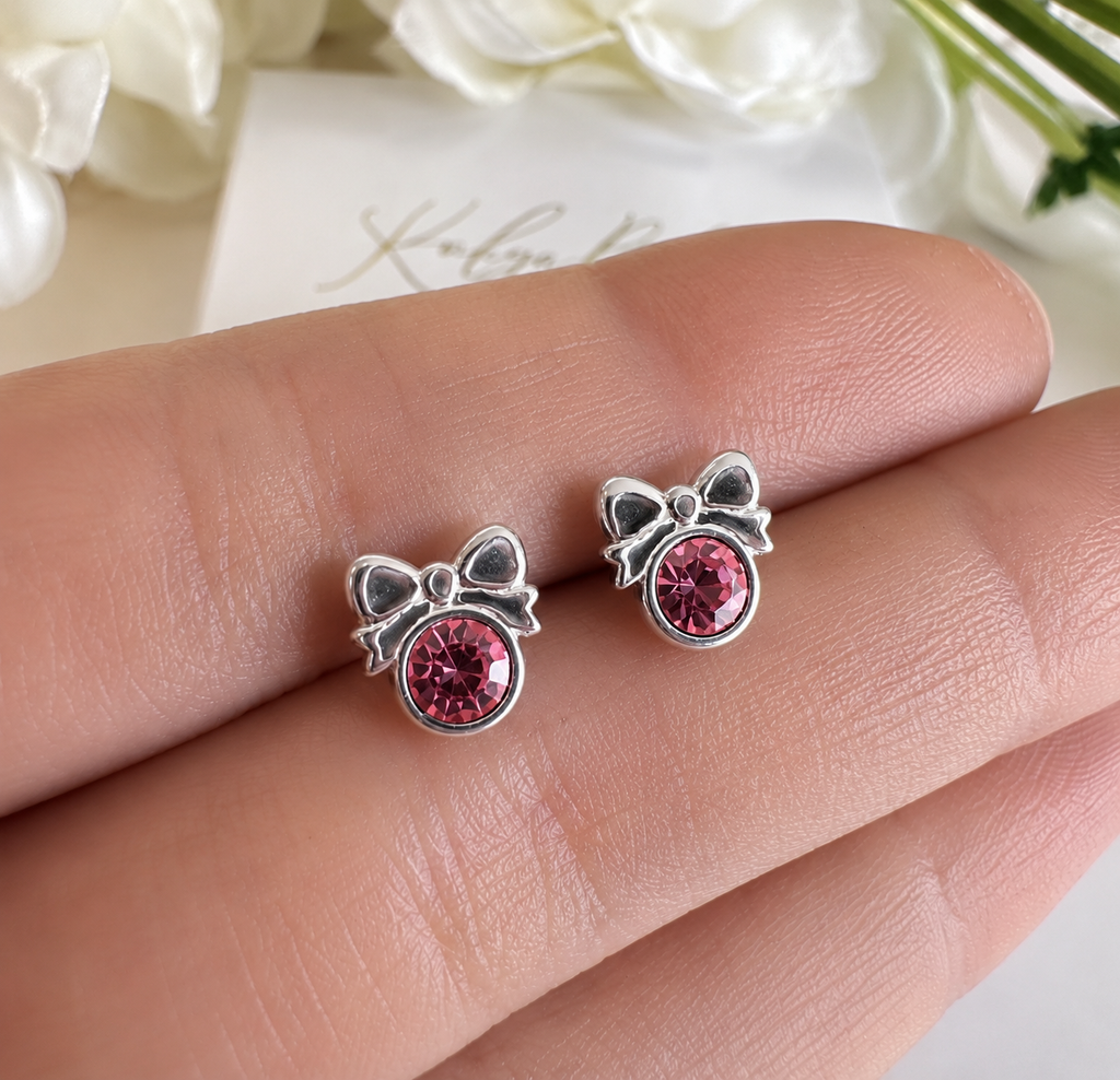 925 sterling silver Pink CZ Bow stud earrings.
