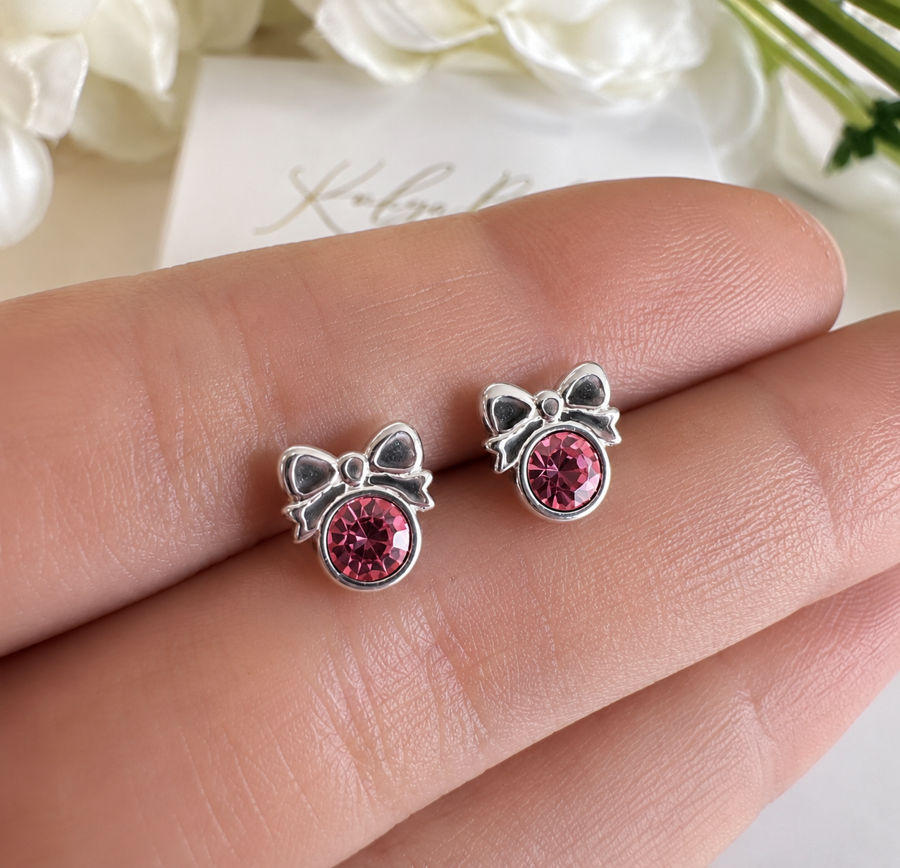 925 sterling silver Pink CZ Bow stud earrings.