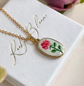 Gold enamel Rose necklace.