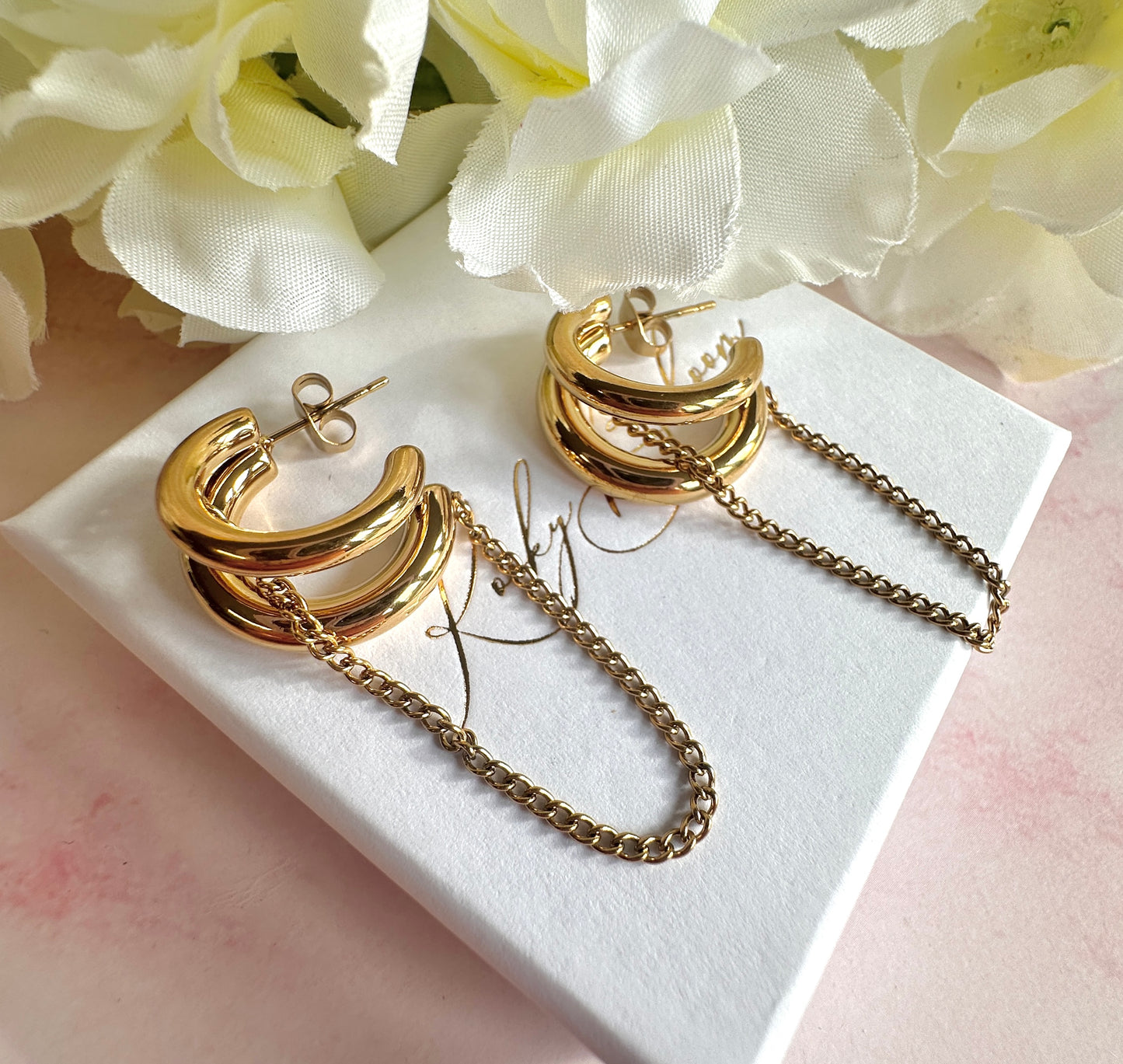 Gold chunky chain loop stud hoop earrings.