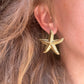 Gold Oversized Starfish stud earrings.