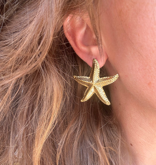 Gold Oversized Starfish stud earrings.