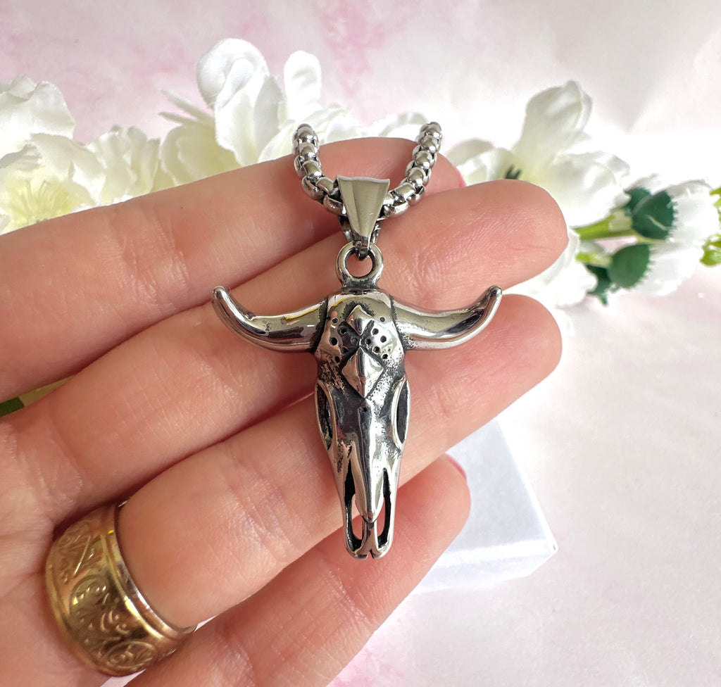 Silver longhorn necklace.