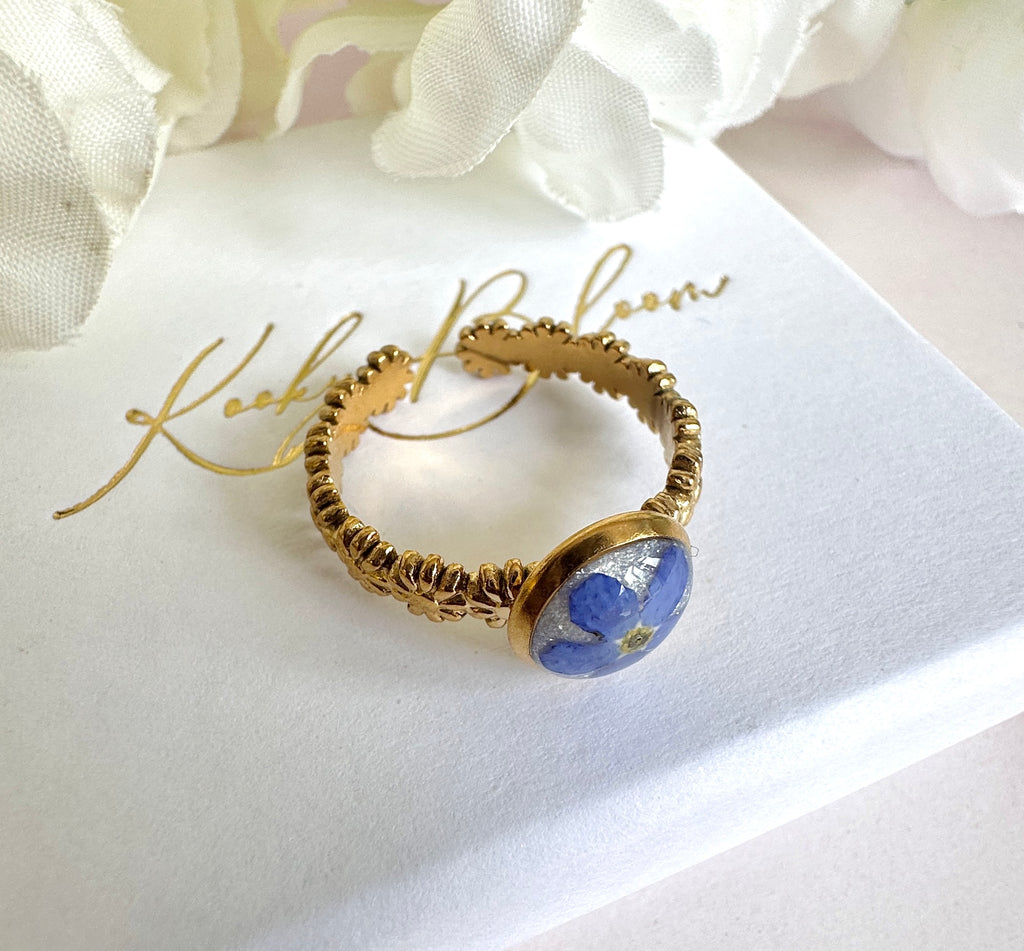 Gold forget me not flower adjustable band ring.