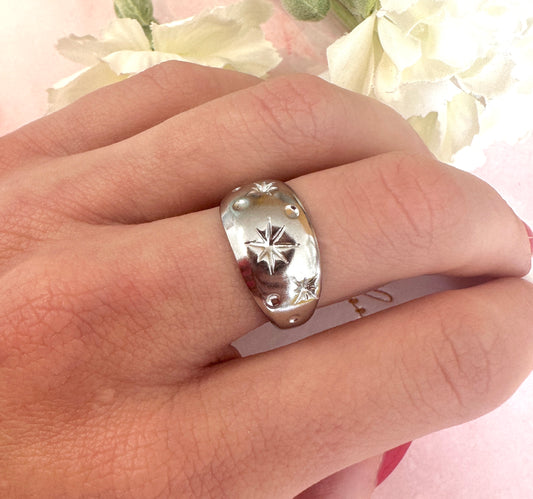 Silver domed celestial ring.