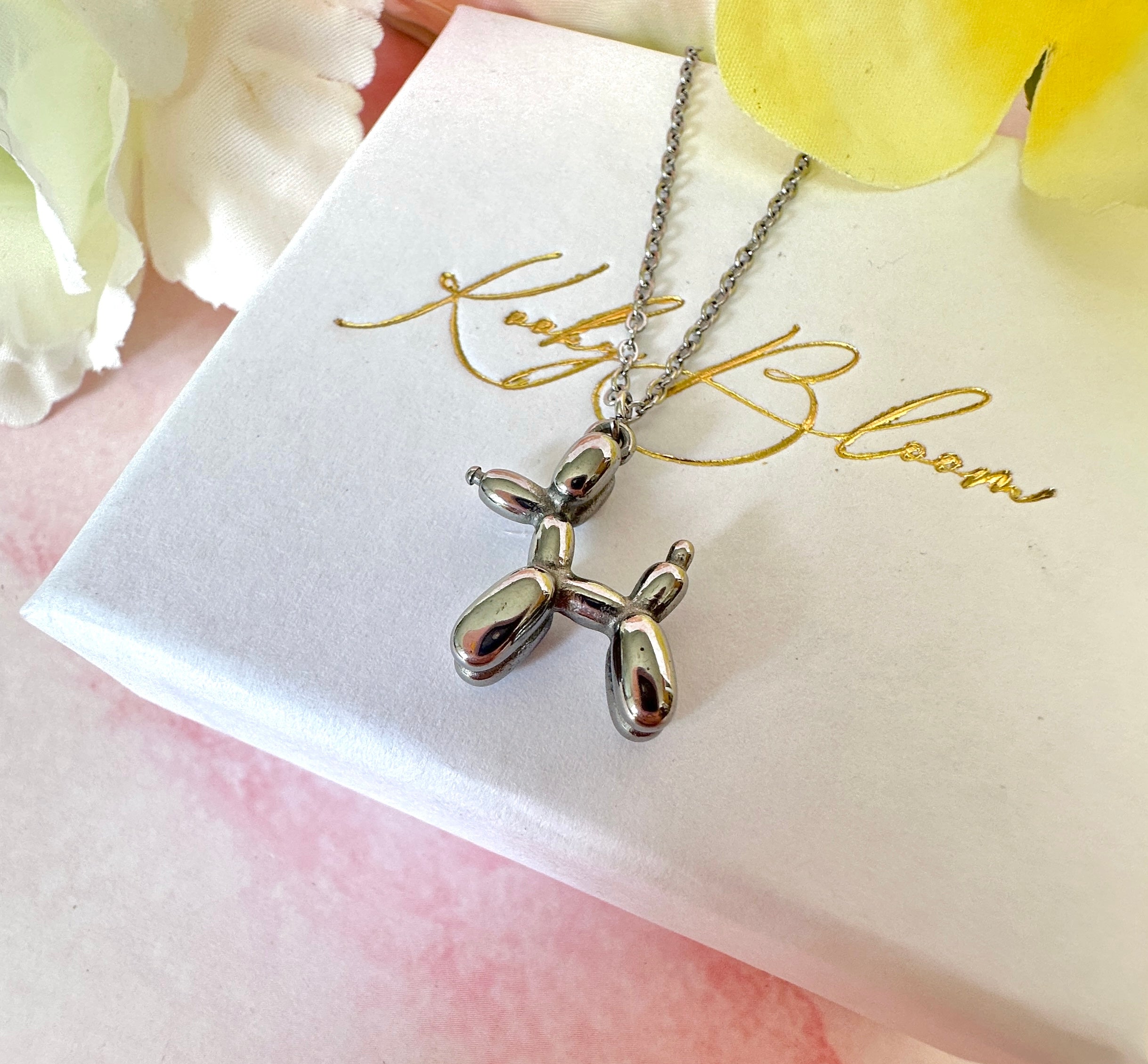 Silver Balloon dog necklace.