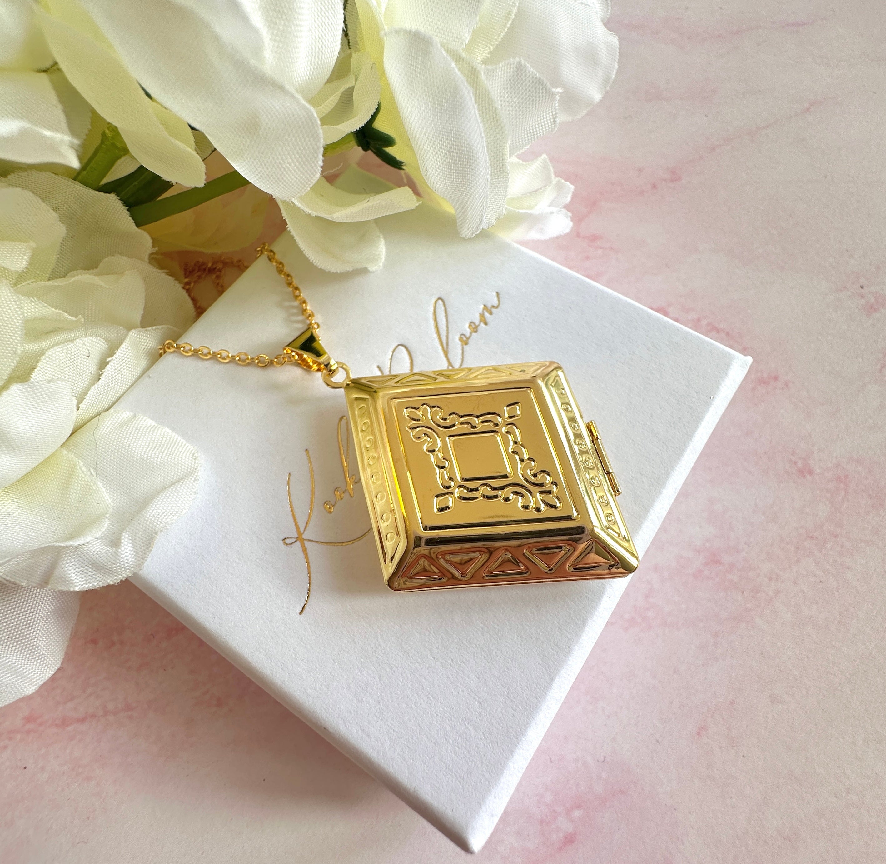 Gold Rhombus Locket necklace.