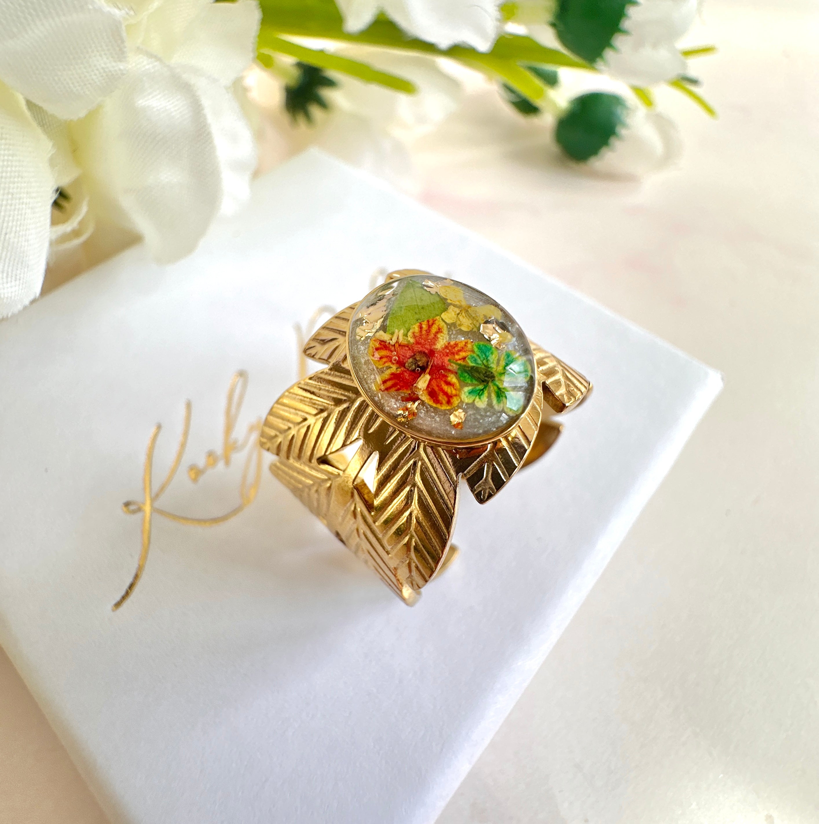 Gold wide Green orange Bloom Leaf cuff ring.