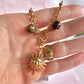 Gold chunky Sun charm necklace.