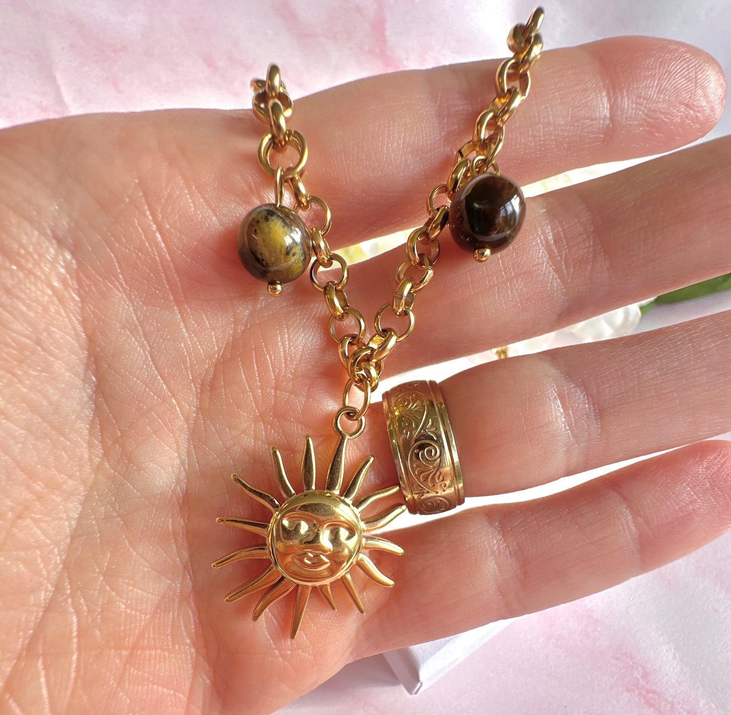 Gold chunky Sun charm necklace.