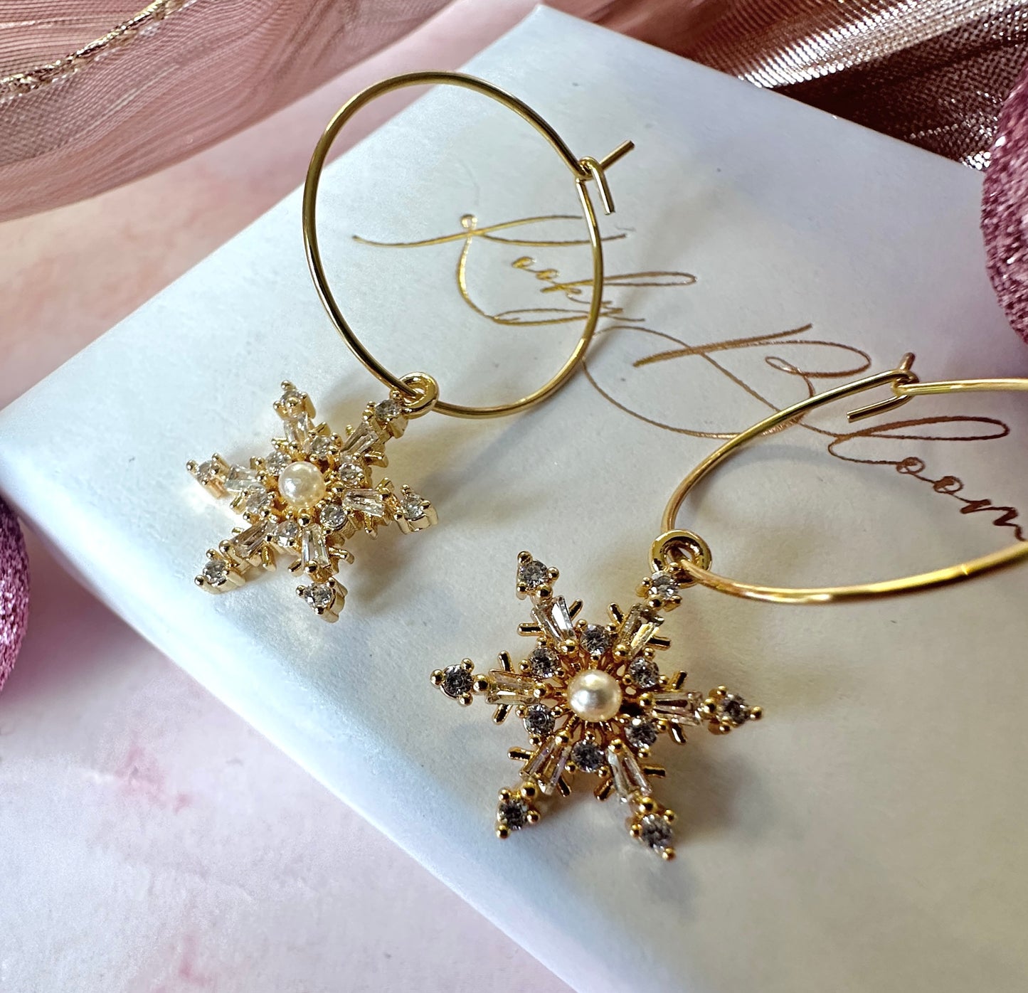 Gold Pearl Cz Snowflake hoop earrings.