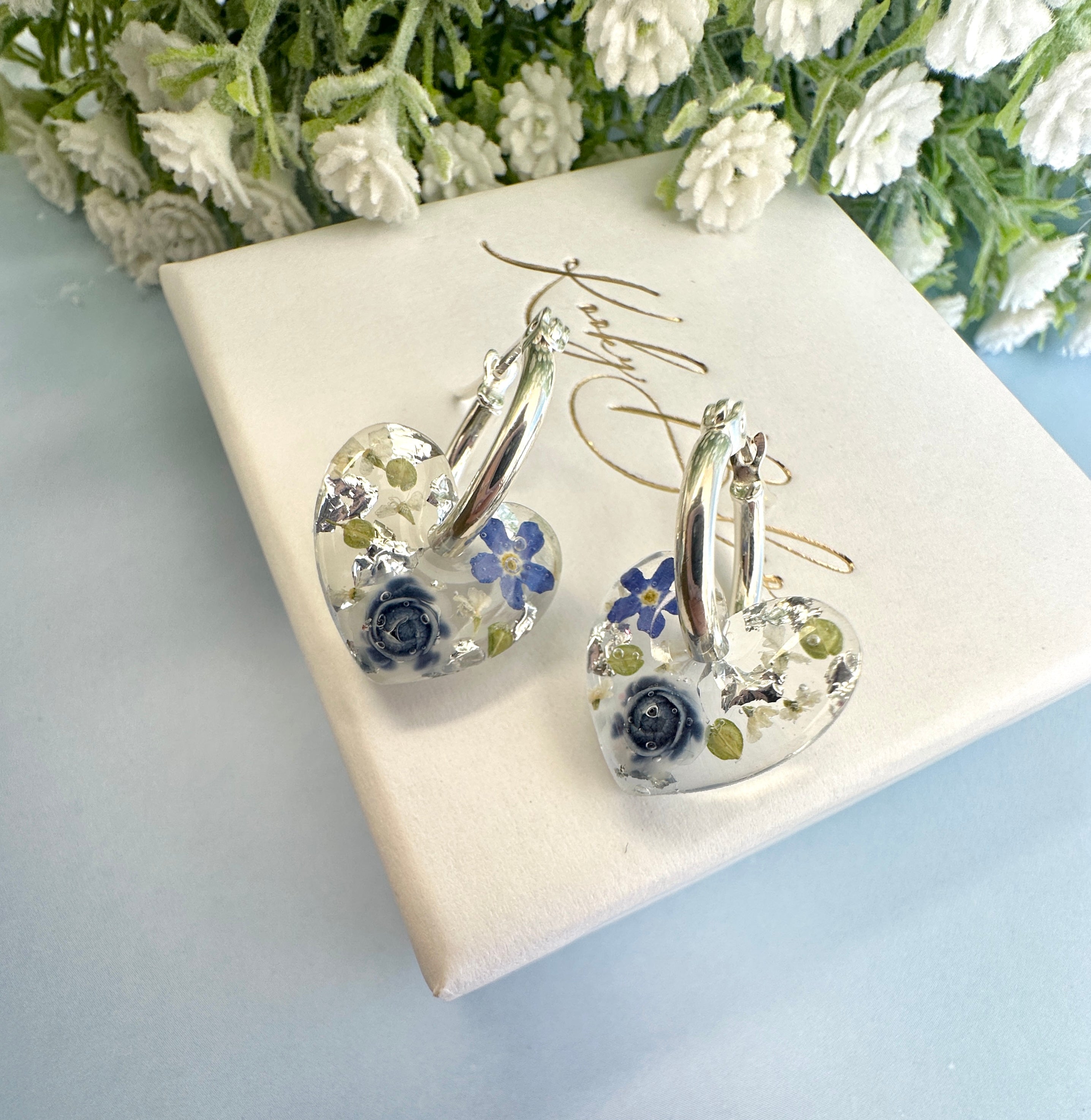 Mini Powder Blue Forget me not heart hoop earrings.
