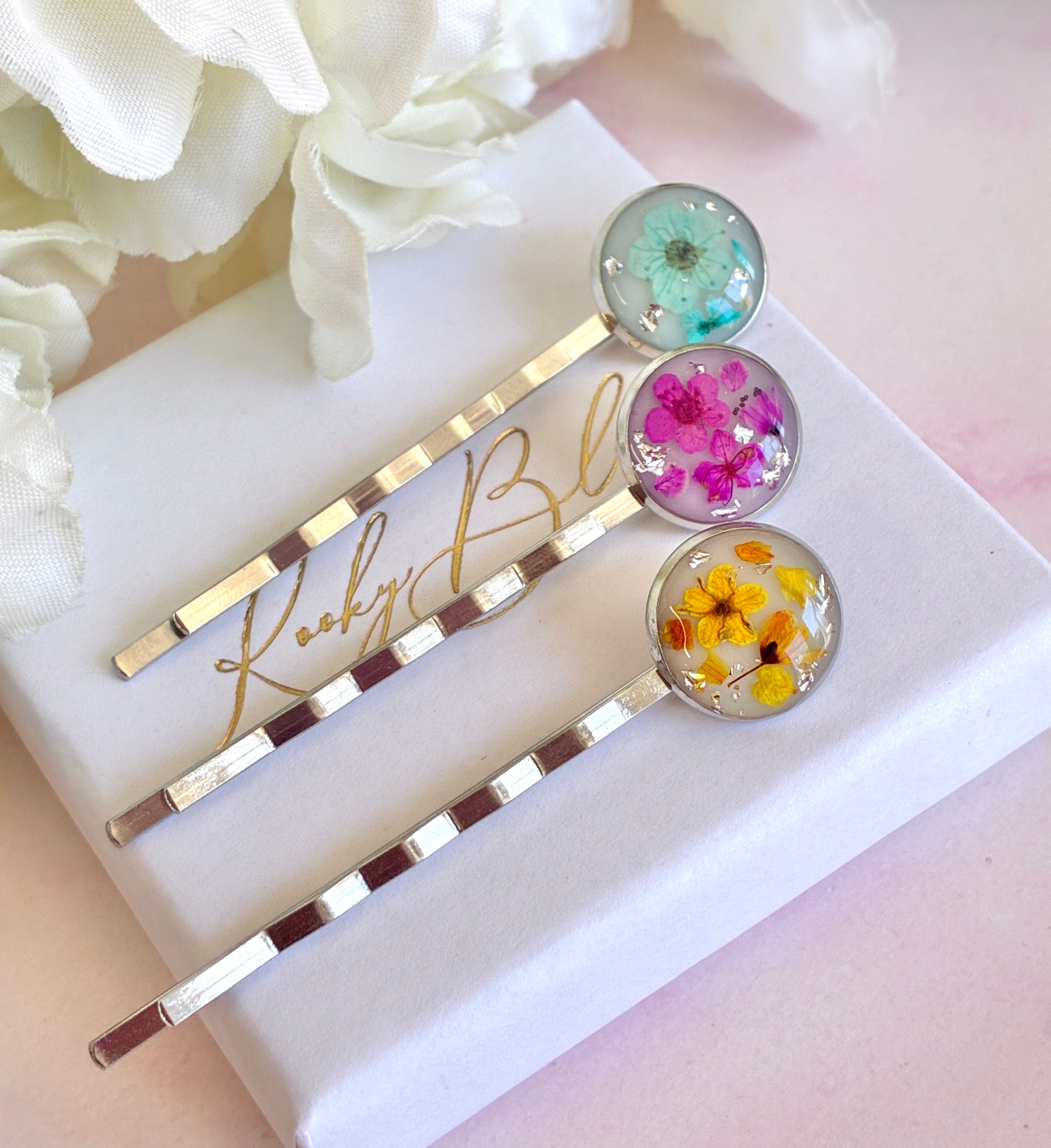 Silver set of 3 Bloom flower hair slides.
