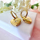Gold Heart Engraved star Huggie hoop earrings.