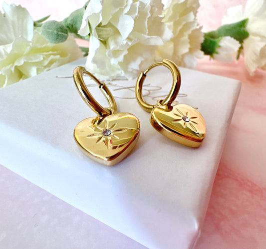 Gold Heart Engraved star Huggie hoop earrings.