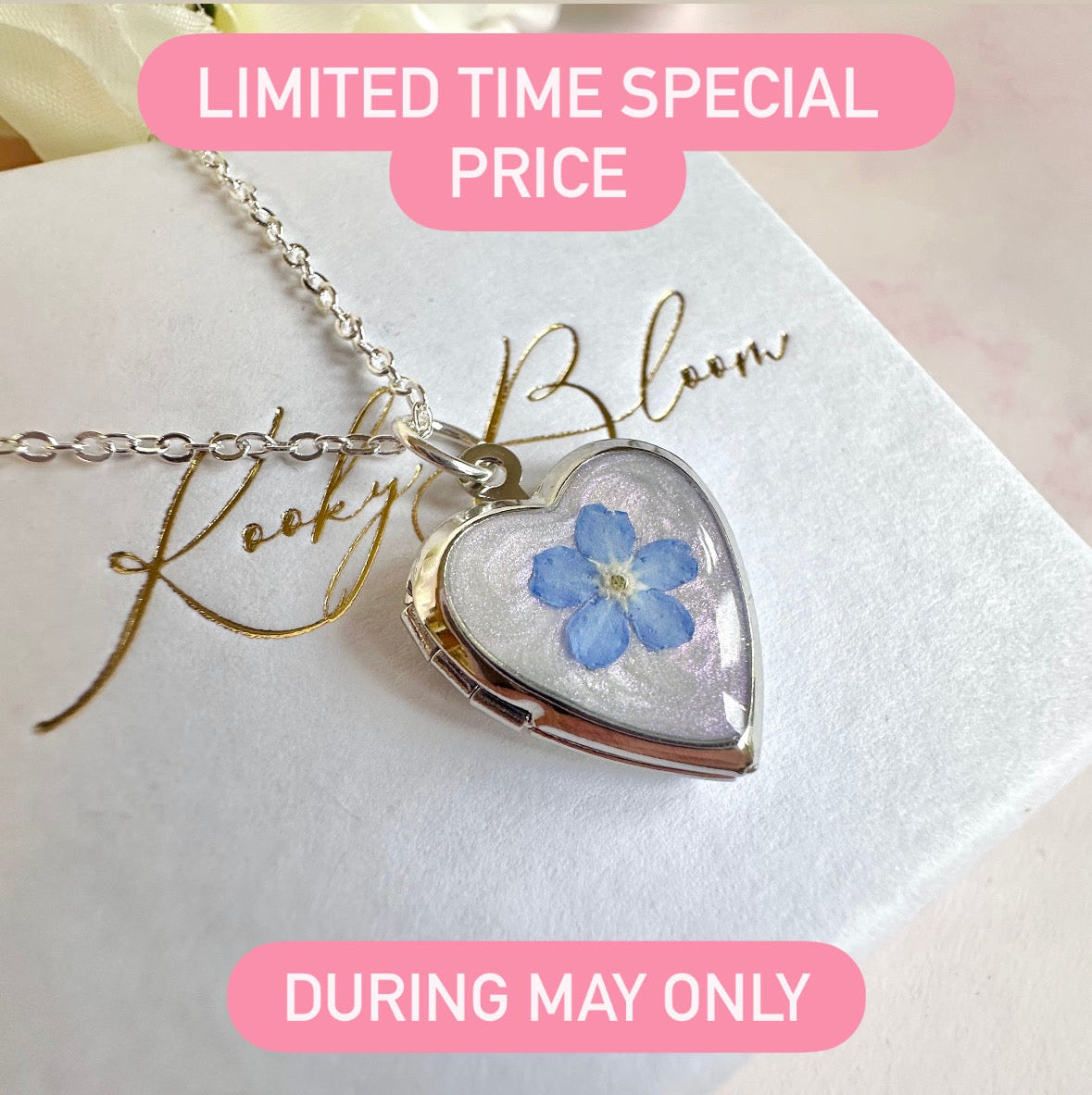 Silver Forget me not flower heart locket necklace.