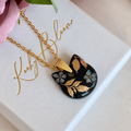 Gold Black bloom Mystical Cat necklace.