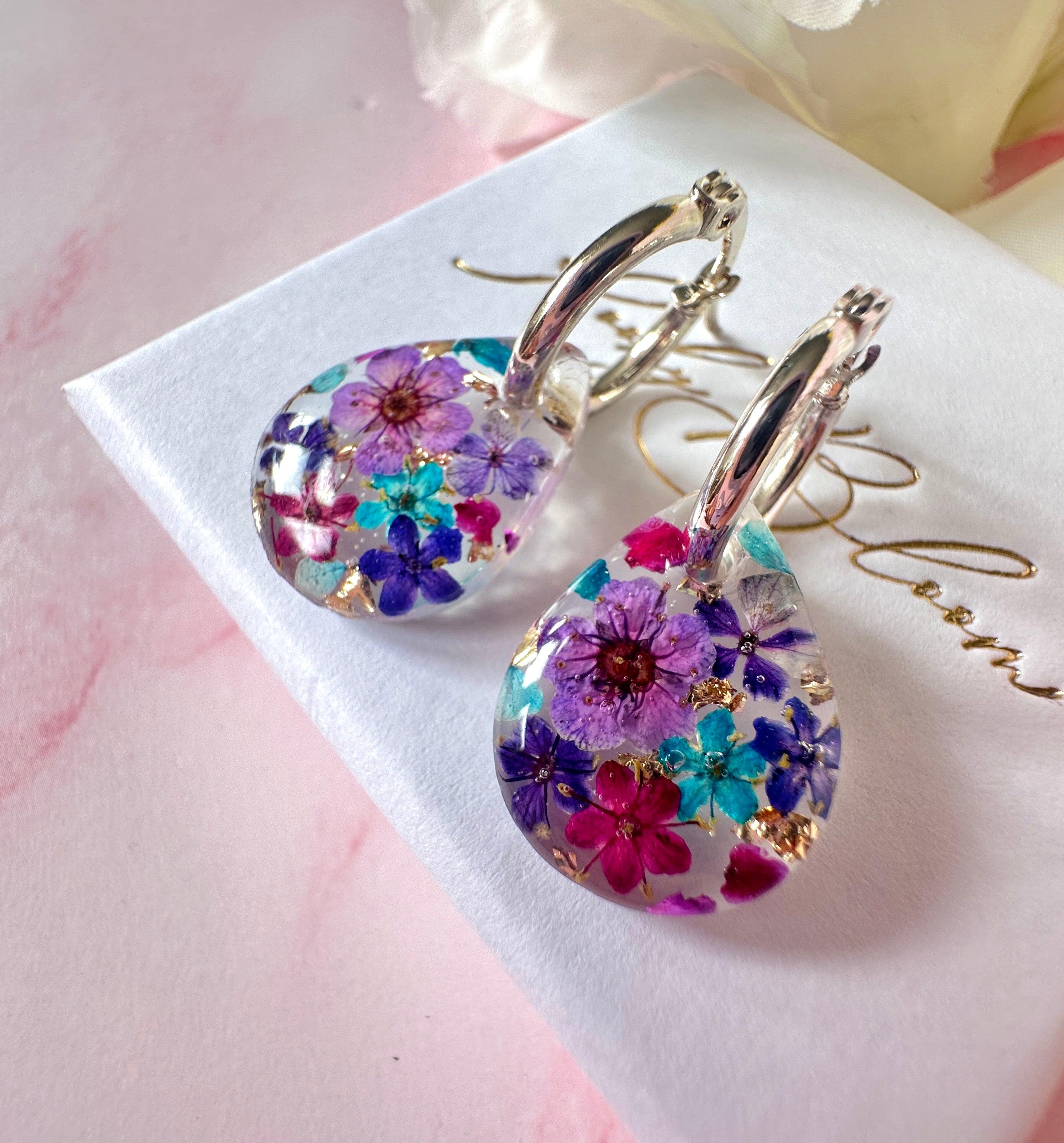 Purple Rain Bloom Teardrop hoop earrings.