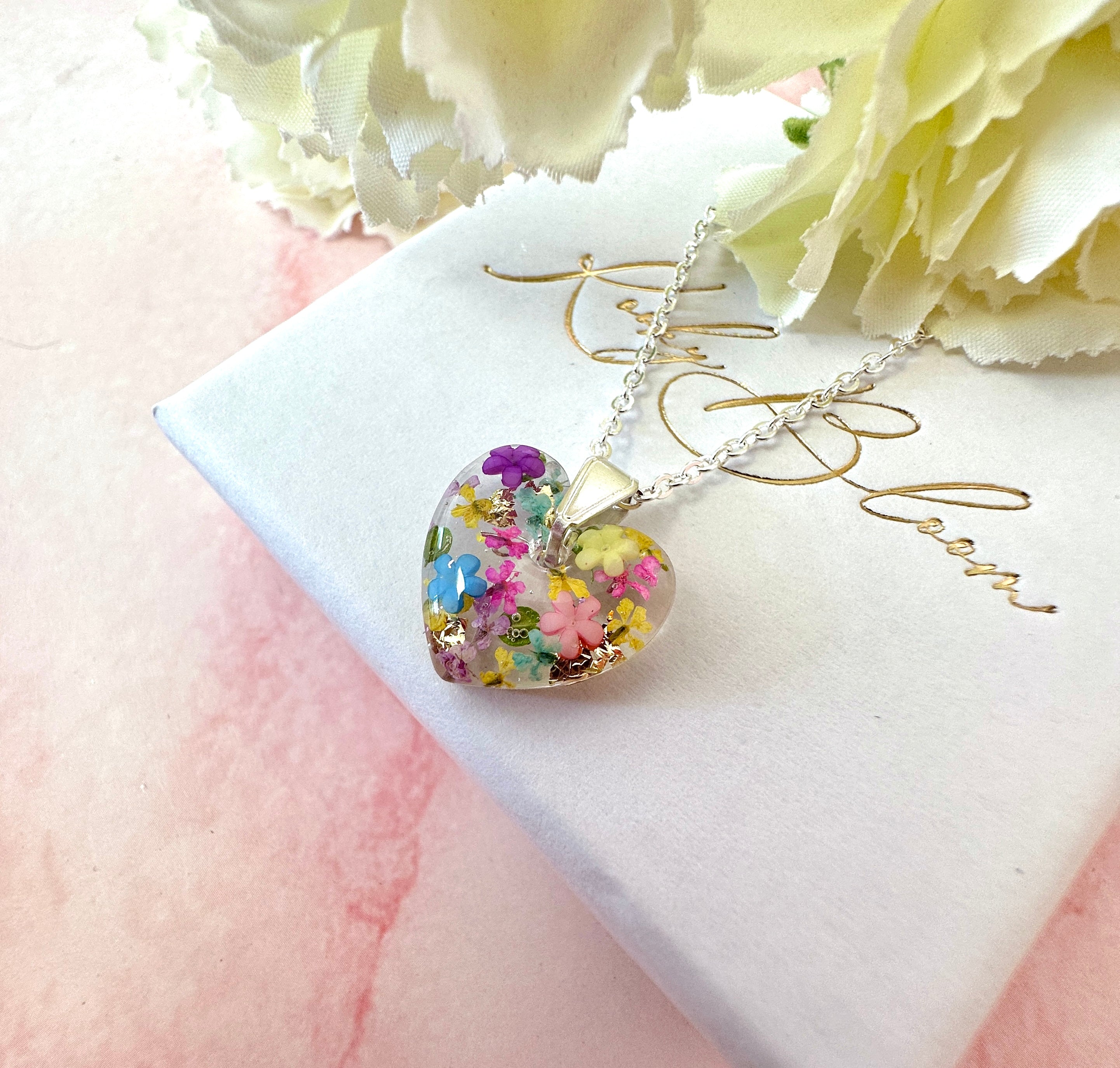 Silver Rainbow Burst bloom Heart necklace.