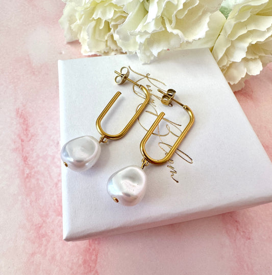 Gold oval pearl nugget hoop stud earrings.
