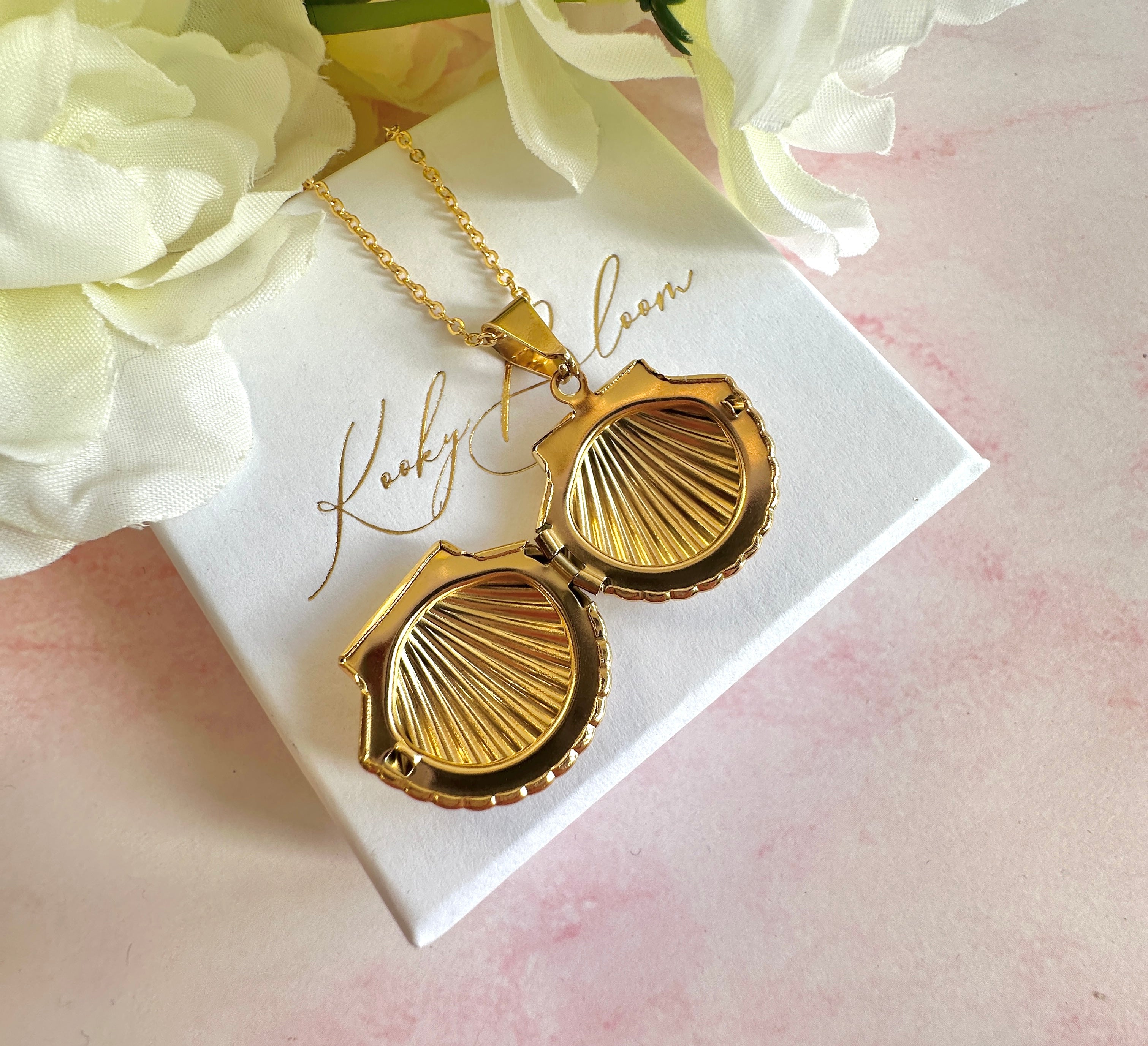 Gold Seashell Locket necklace.