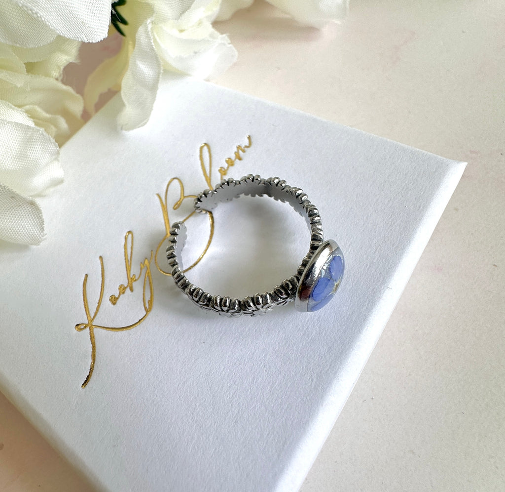 Silver forget me not flower adjustable band ring.