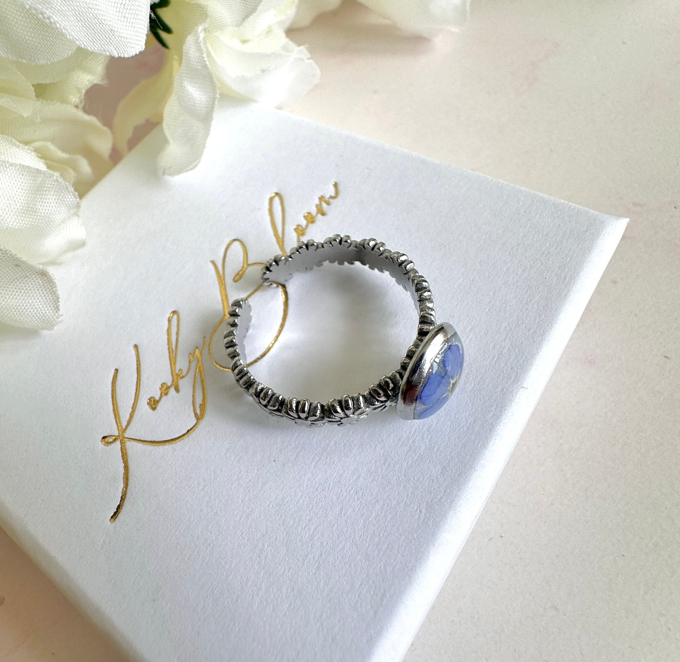 Silver forget me not flower adjustable band ring.