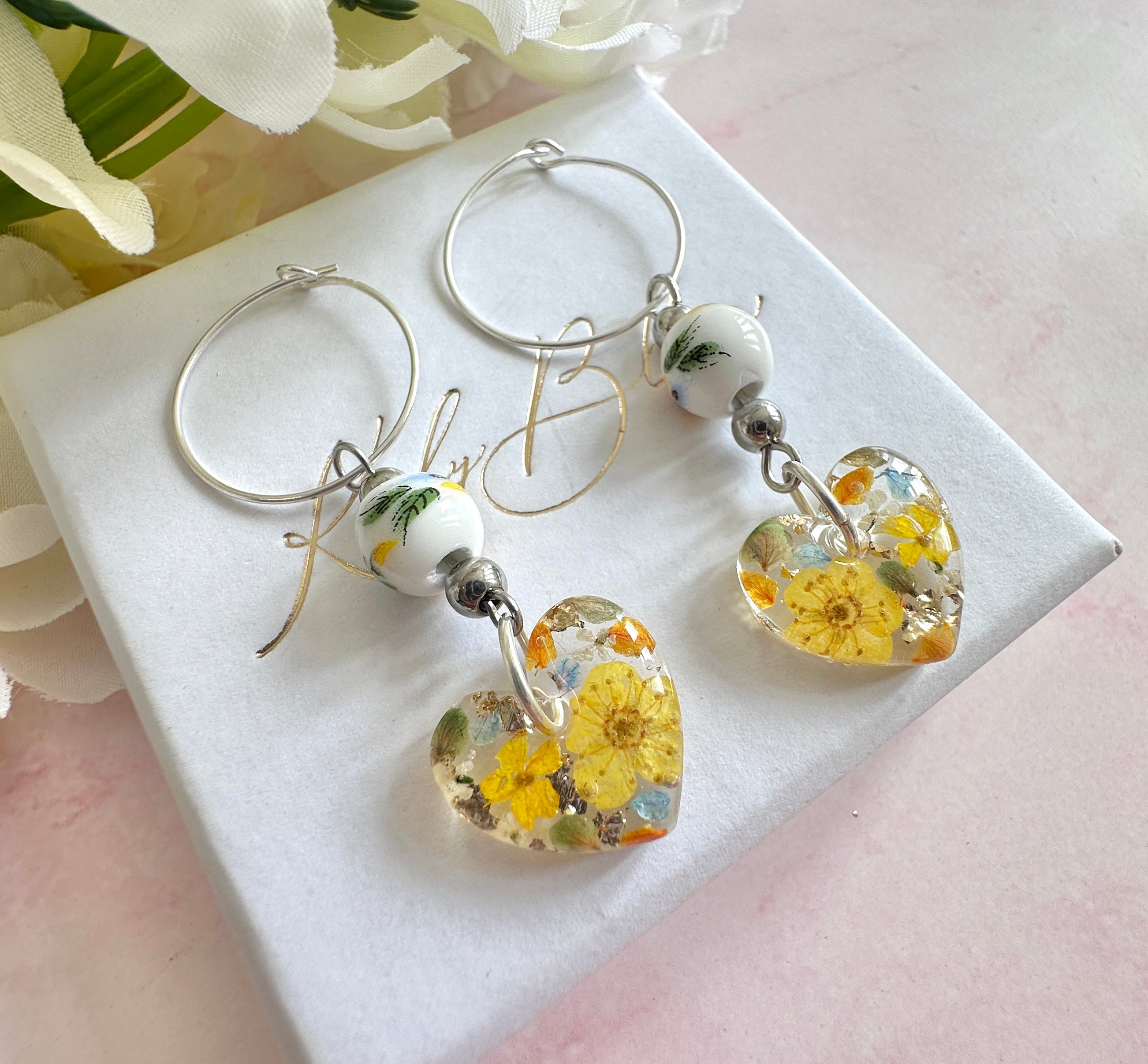 Sunflower Bead Blossom heart drop hoop earrings.