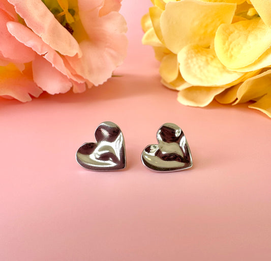 Silver Wobbly Heart stud earrings.