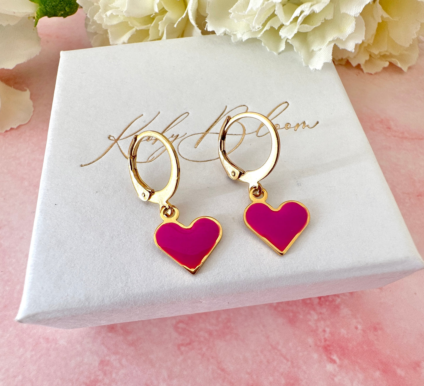 Gold Enamel Heart Huggie earrings.