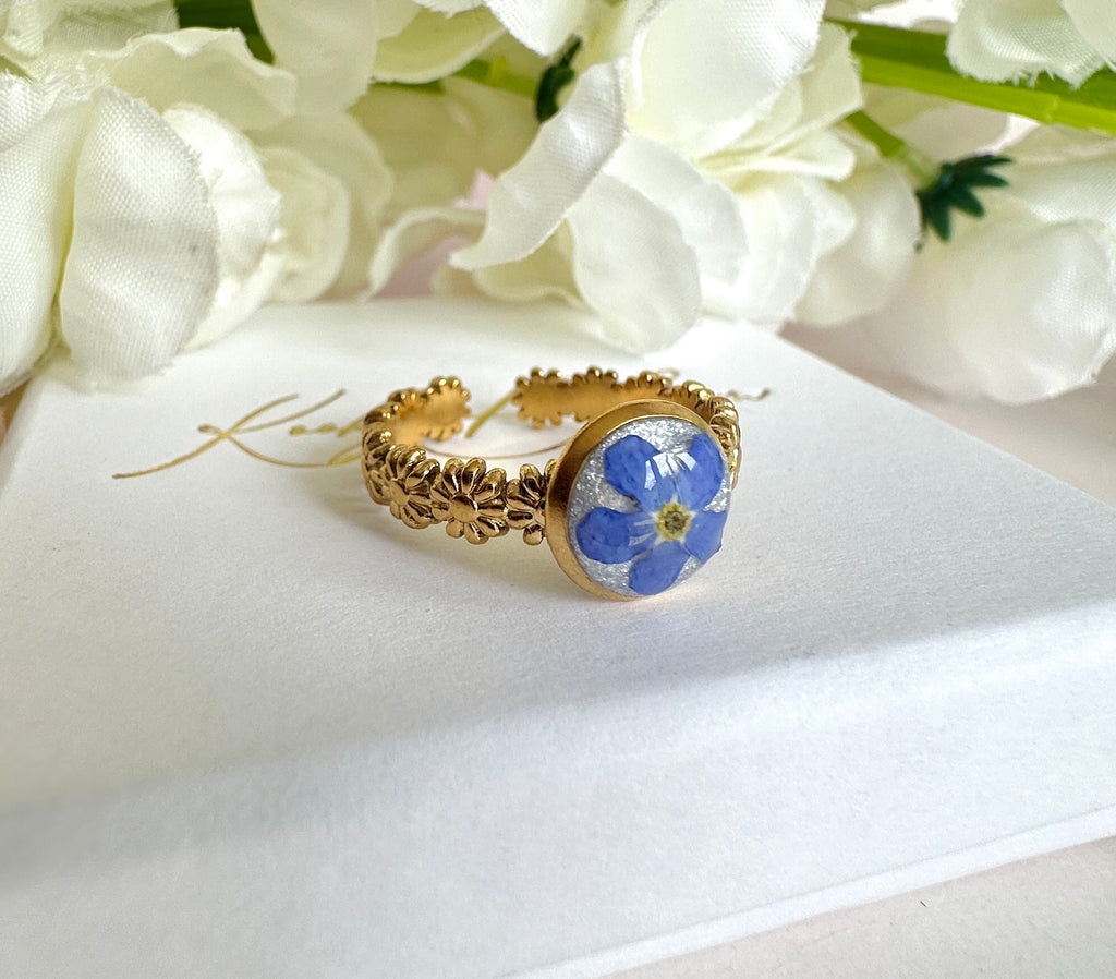 Gold forget me not flower adjustable band ring.