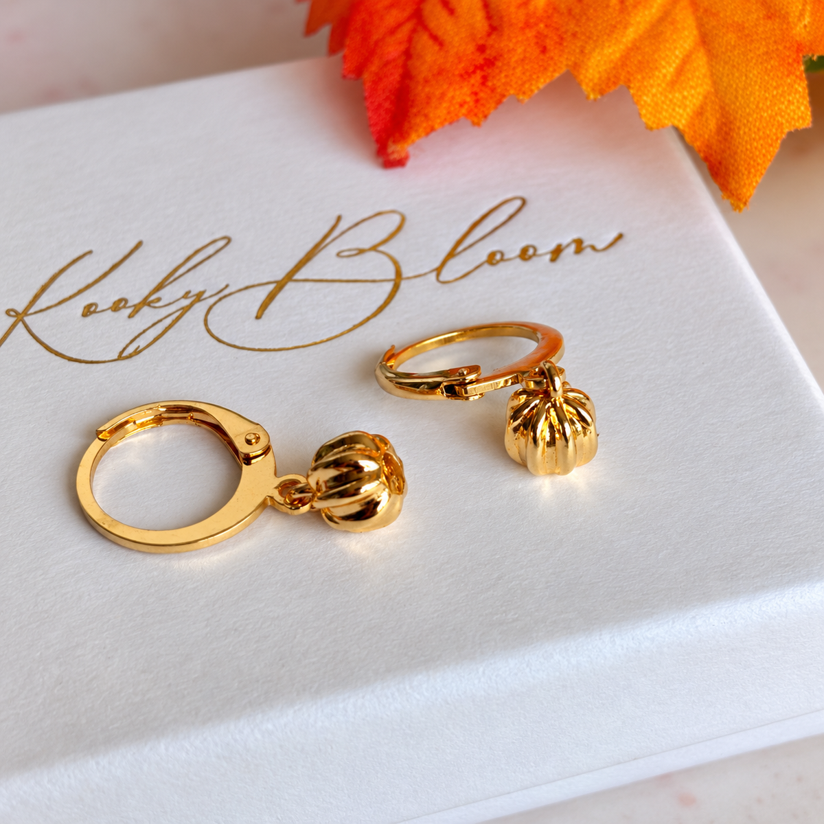 Gold Teeny pumpkin Huggies.