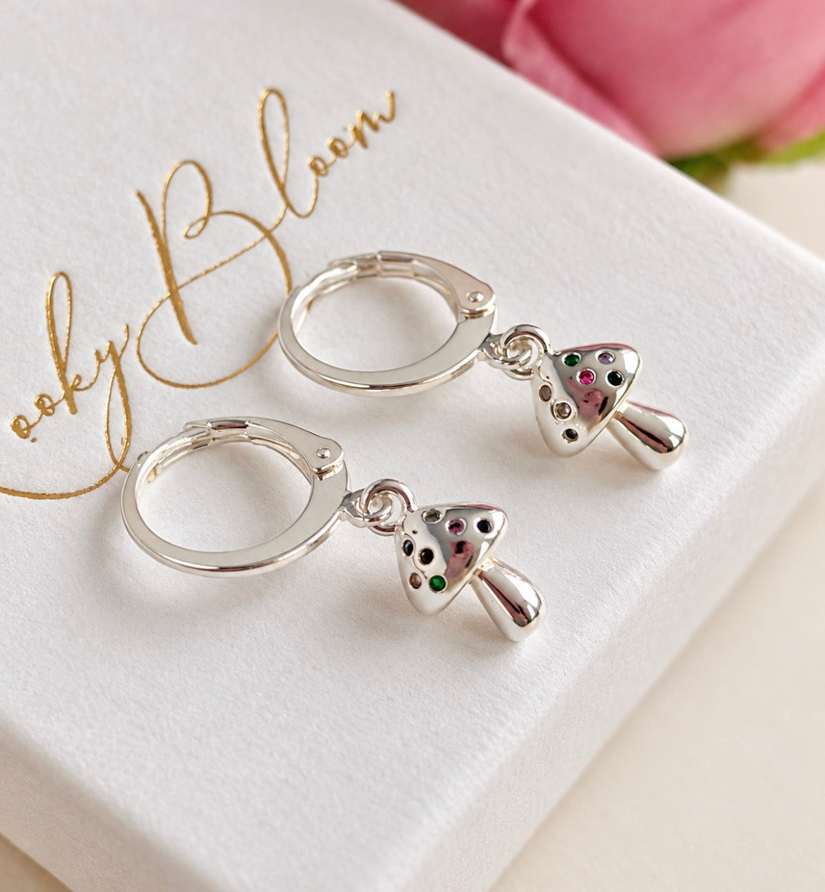 Silver Teeny CZ Toadstool huggie earrings.
