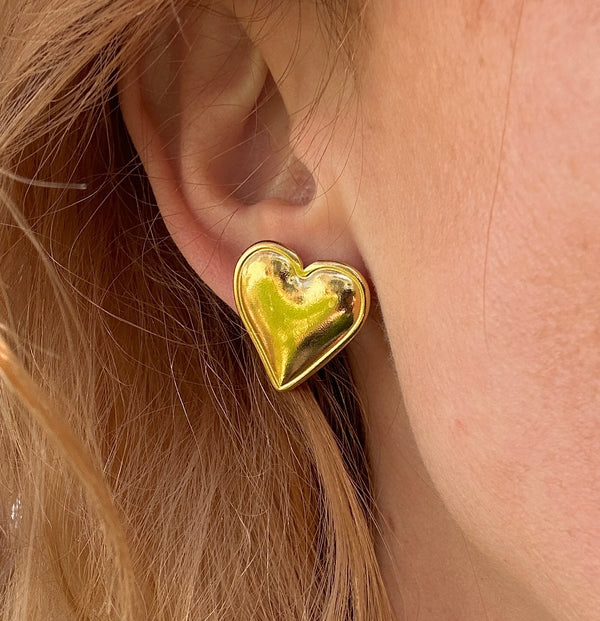 Oversized gold Heart stud earrings.