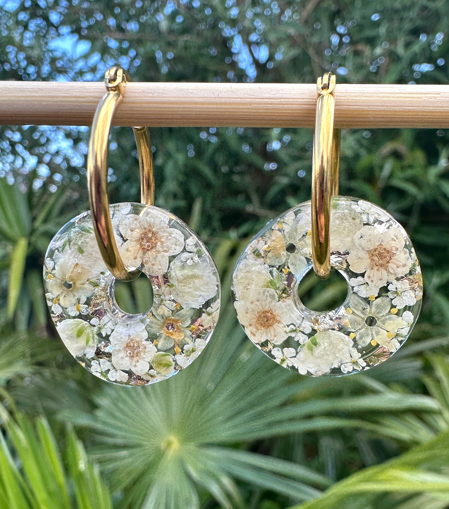 Ivory Flower Donut Hoop earrings.